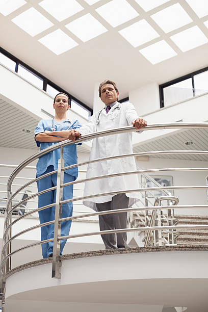 istock Nurse and doctor standing at the stairwell 178500821