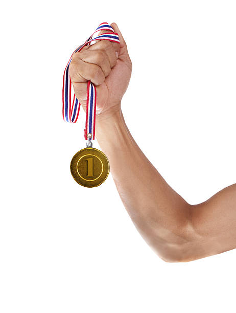 istock hand and number one glod medal 178500917
