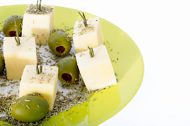Tray with canape at the event. Snack with olives and cheese