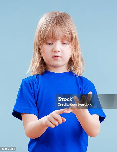 Child Counting On Fingers Stock Photo - Download Image Now - Blue, Blue Background, Boys