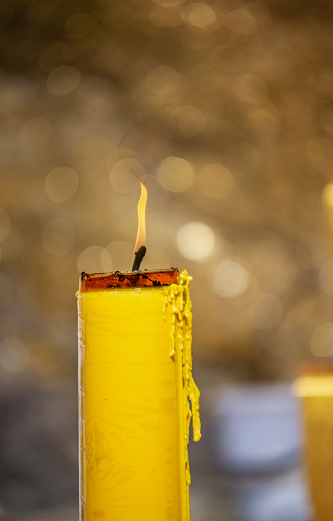 Candlelight with golden yellow sparkling background