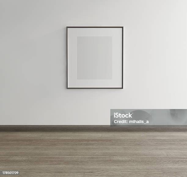 Framed Art Of Gray Rectangle Hanging Above Gray Wood Floor Stock Photo - Download Image Now