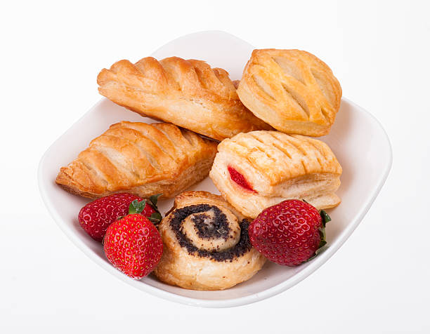 istock buns and strawberry on plate isolated 178502076