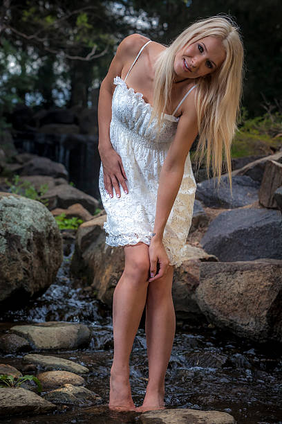 istock Pretty Young Women at Waterfall 178502371