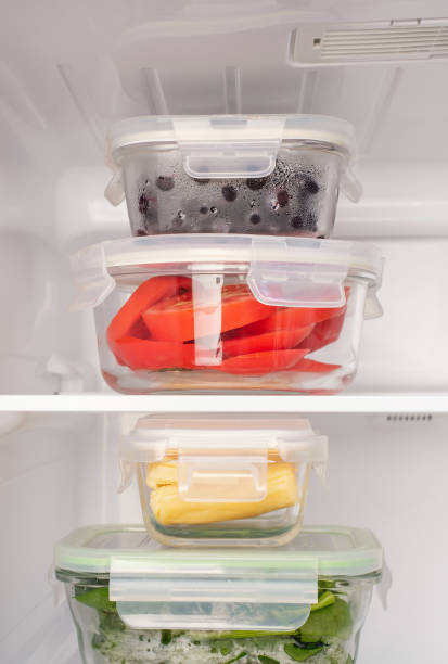 istock Vegetables and berries in glass containers in the refrigerator close-up. 1785025227