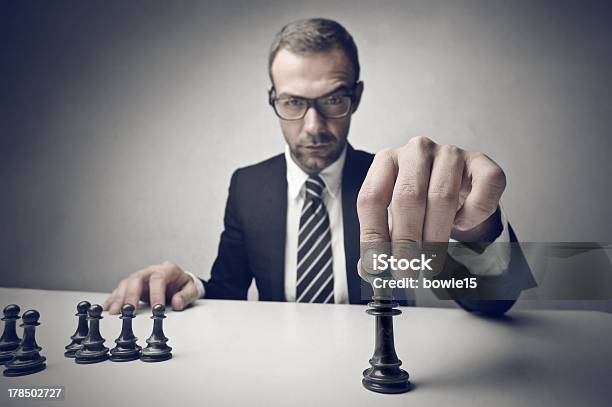 Man In A Suit With Chess Pieces Stock Photo - Download Image Now - Businessman, Chess, Playing