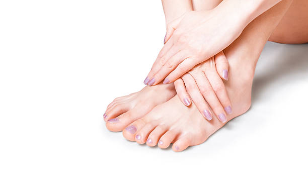 istock Women tanned bare feet on the white background 178502913