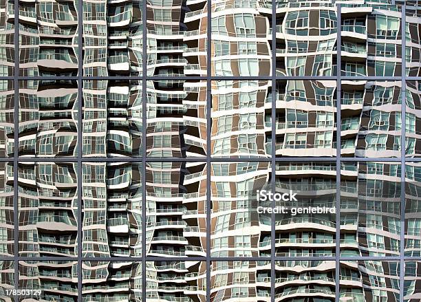 High Rise Building Reflected In Wavy Glass Window Stock Photo - Download Image Now - Abstract, Apartment, Architectural Feature