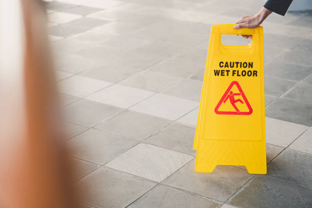 istock cleaning in progress sign on yellow plastic board on floor 1785038162