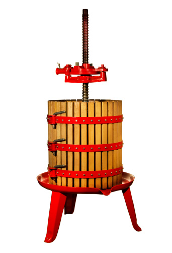 Traditional wine press on a white background