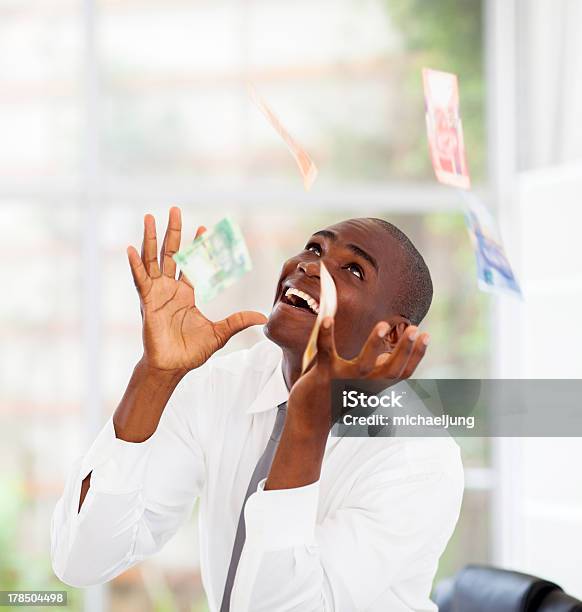 Businessman Catching Money Falling From Above Stock Photo - Download Image Now - South African Currency, African Ethnicity, Currency