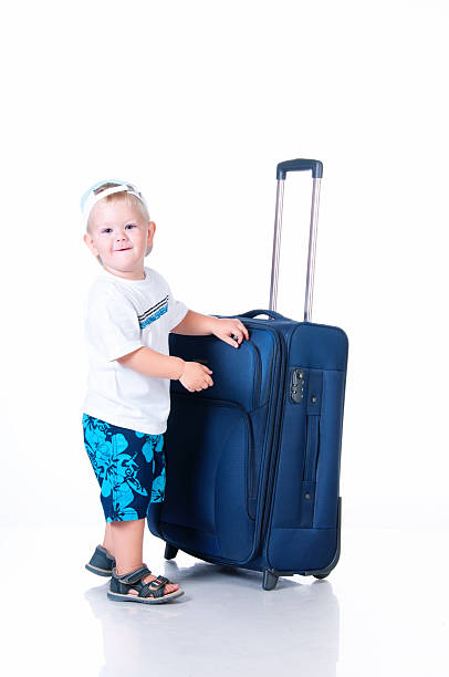 istock Small tourist with suitcase on white background 178504758