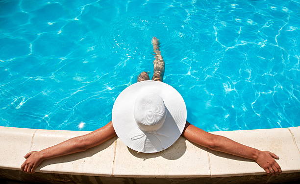 istock Young woman sitting on the pool. 178504951
