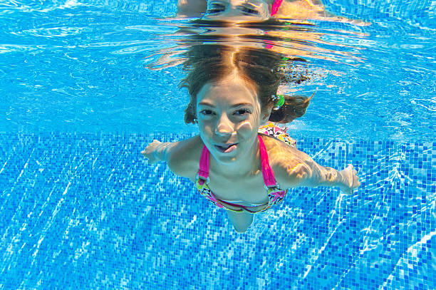 istock Happy smiling underwater child in swimming pool 178505001