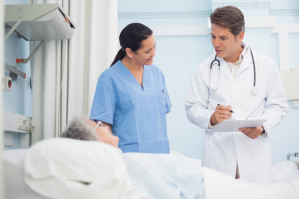 istock Doctor and nurse talking to a patient 178505092