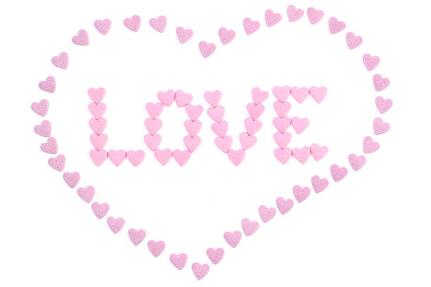 The word 'love' written with small candy hearts