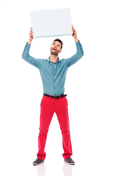 istock Happy man holding a blank sign overhead 178509217