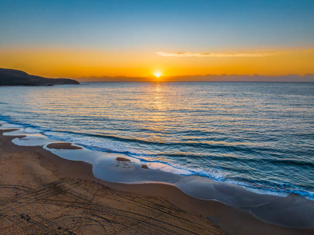 istock Sunrise at the seaside with orange horizon 1785099965