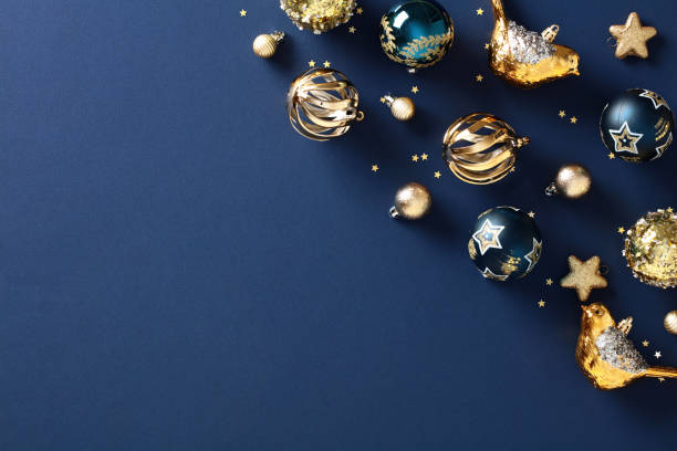 istock Abstract Christmas composition, elegant gold bauble ornaments on dark blue background. Festive luxury design for holiday card, invitation, or poster 1785100022