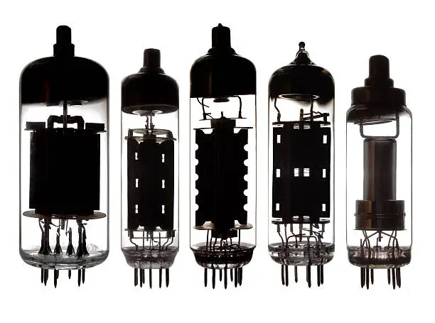 Glass vacuum radio tubes.High-contrast photo in backlight.Isolated on white background.