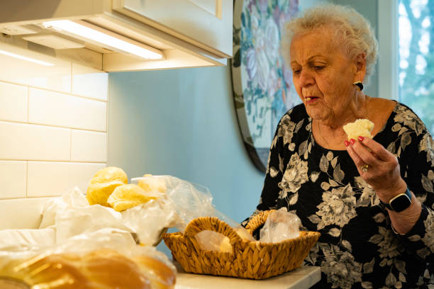 istock Woman sneaks a dinner roll before Thanksgiving 1785105737
