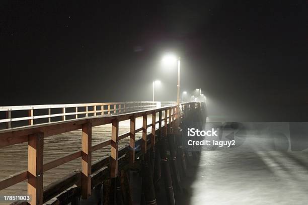 Pier At Sunset Stock Photo - Download Image Now - Horizontal, Long Exposure, Mystery