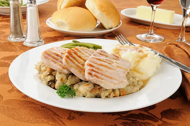 Grilled pork chops with mashed potatoes and herb dressing