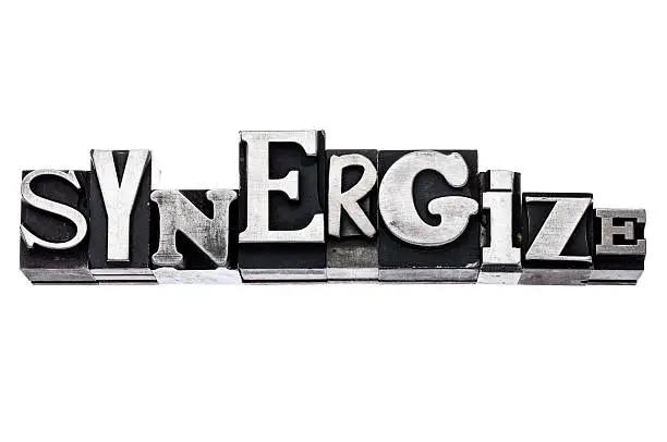 Photo of synergize word in metal type