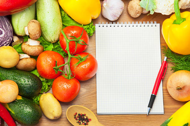 istock Organic Vegetables on Wooden Background and Notebook 178511347