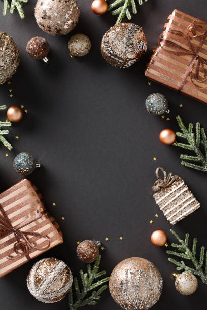 istock Vertical banner features a stylish frame of Christmas decorations, including elegant bronze baubles and festive gifts on a grey background. Ideal for your holiday season design. Merry Xmas 1785114237