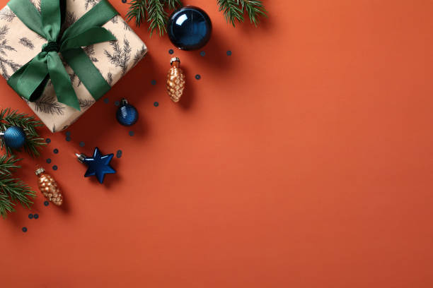 istock Elegant Christmas gift box with festive decorations on a vintage brown background 1785123862