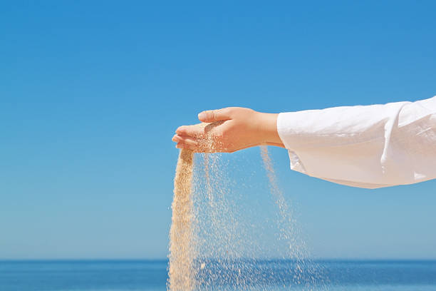 istock Girl pours sand from his hands. 178512821