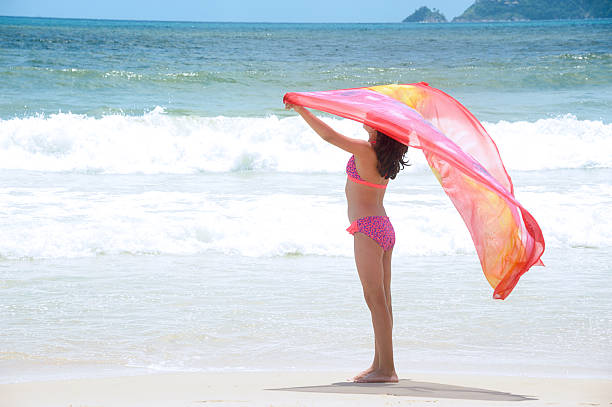 istock little girl on beach 178512850