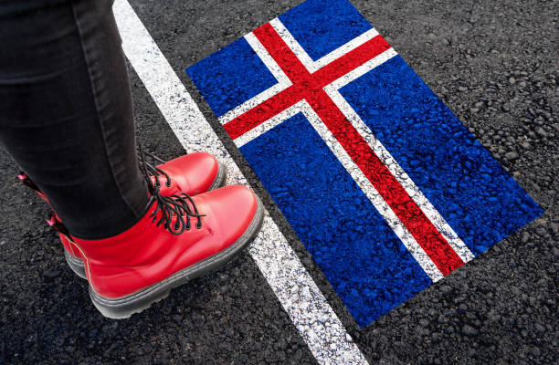 istock a womman  standing next to flag of Iceland 1785134456