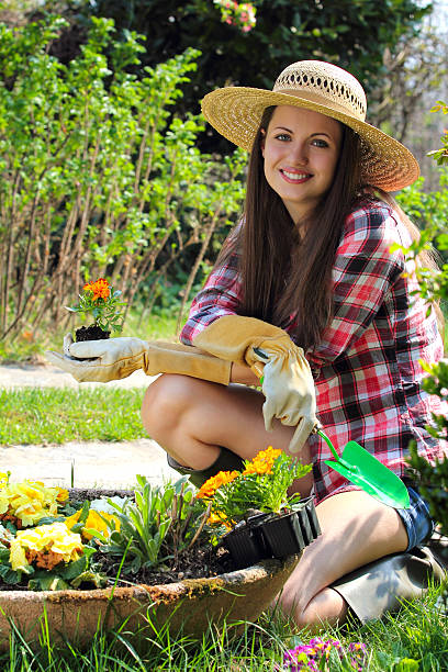 istock Beautiful gardener smiles in a relax pose 178514758
