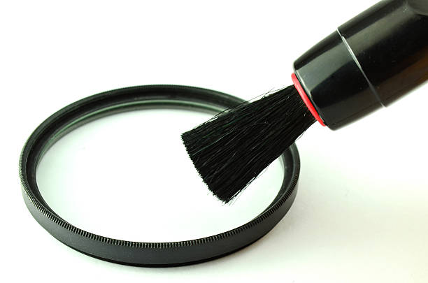 istock Cleaning filter of camera with tool isolated 178515115