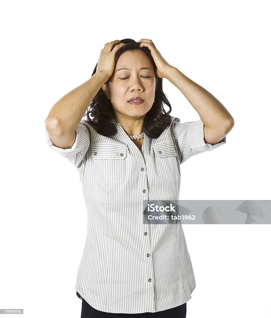 Stressed Out Asian women expressing frustration dressed in casual work clothing on white background Adult Stock Photo