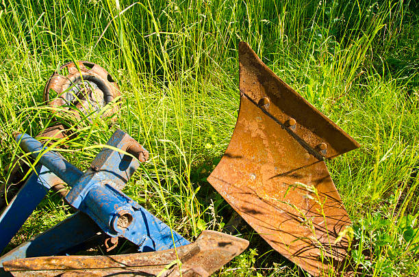 istock old rusty tractor plow on grass in farm 178515878