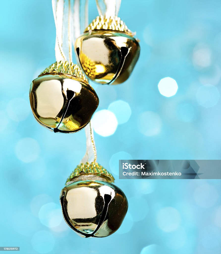 Christmas bells with ribbon, defocused blue lights on background "Christmas bells with ribbon, defocused blue lights on background" Jingle Bell Stock Photo