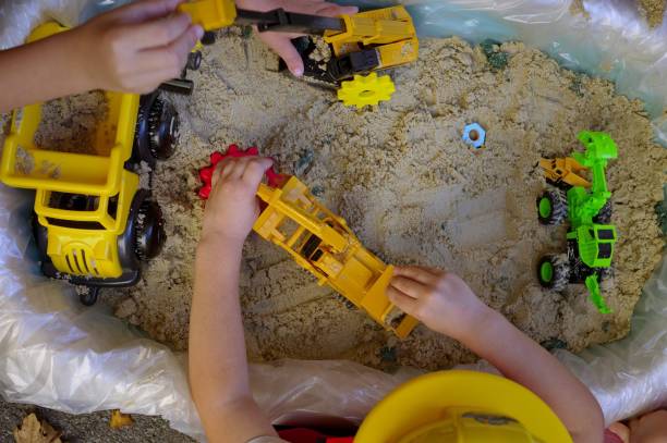 istock Toddlers playing in sand 1785160240