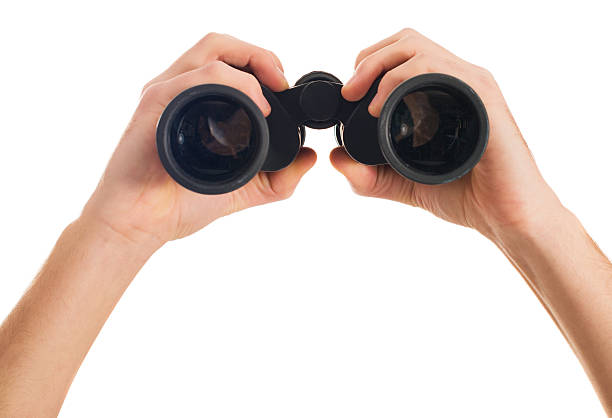 istock Close-up Of Human Hand Holding Binoculars 178517089