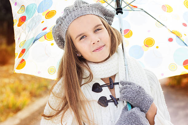 istock girl with colorful umbrella 178517742