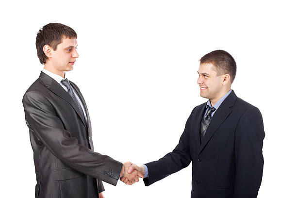istock Young business men shaking hands isolated on white background 178519045