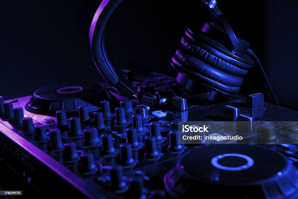 dj mixer with headphones dj mixer with headphones at nightclub Arts Culture and Entertainment Stock Photo