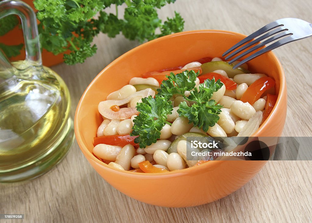 Bowl of stewed beans and vegetables Bbowl of stewed beans with vegetables decorated with parsley. Backgrounds Stock Photo