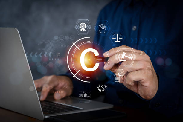 istock Copyright or patent concept, Person hand using laptop computer on desk with VR screen copyright icon background, Copyleft trademark license. 1785193512