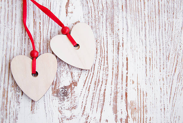 istock Hearts on wooden background 178520224