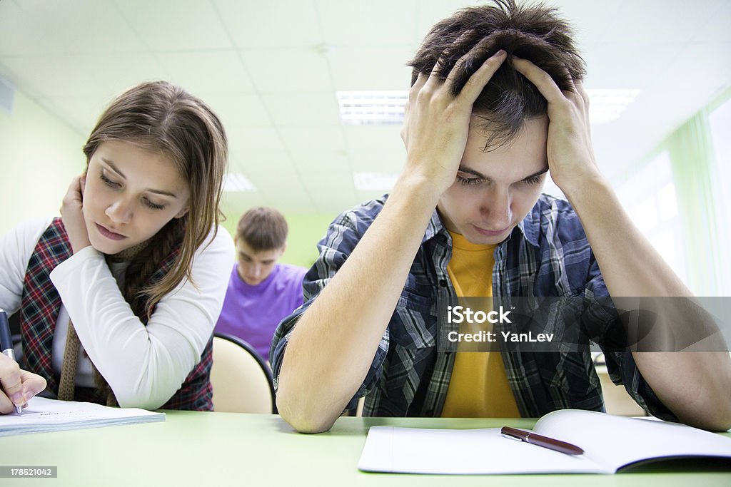 students on exam  in class group of students takes the test in class Adult Stock Photo