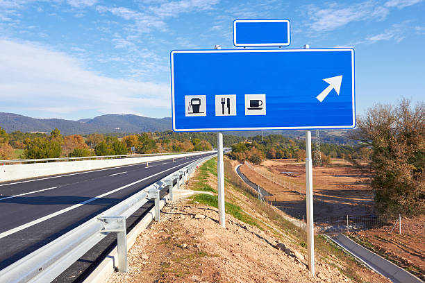 road sign along a highway stock photo