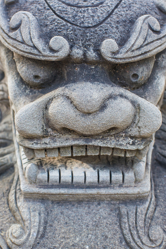 The face of an ancient stone carving